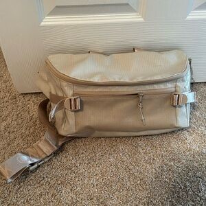 CalPak terra-cotta sling bag ￼
Larger size